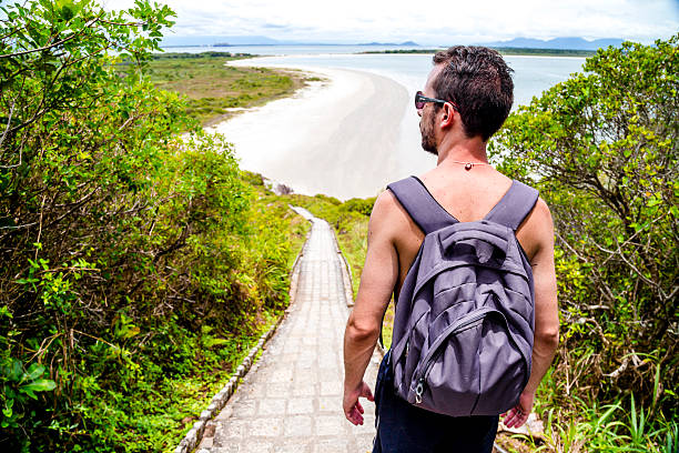 Young man exploring Ilha do Mel / PR / Brazil.