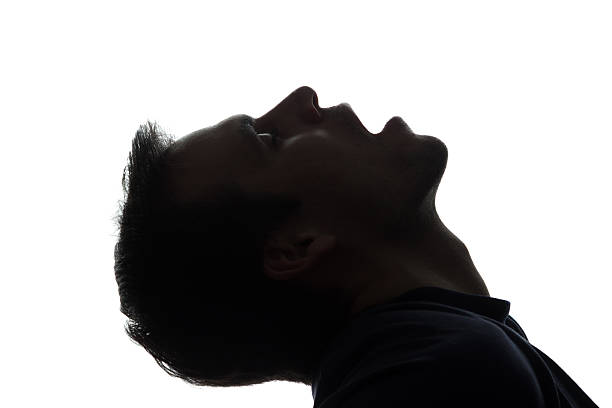 istock Portrait of young man with his mouth open, side view 637357304