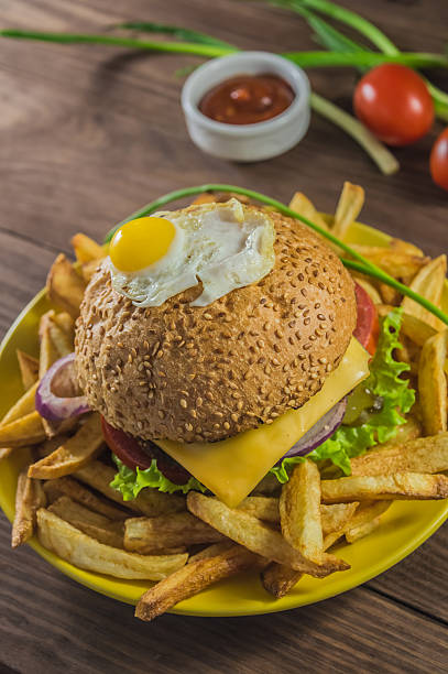 istock Big sandwich - hamburger burger with beef, cheese, tomato.On 637357346