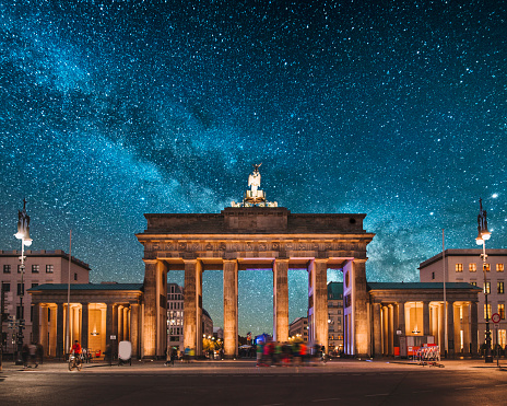 Brandenburg Gate in Berlin, Germany, at night, under a beautiful starry sky