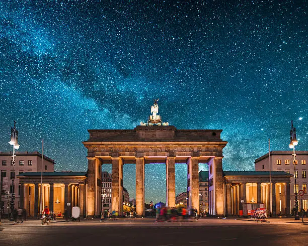 Brandenburg Gate in Berlin, Germany, at night, under a beautiful starry sky