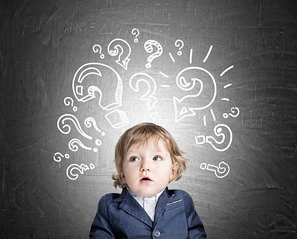 istock Baby boy and question marks on chalkboard 637360814