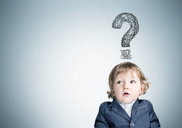 istock Baby boy and question mark on gray wall 637360860