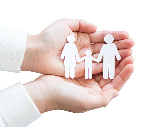 istock Paper cut family in hands isolated on white background 637365188