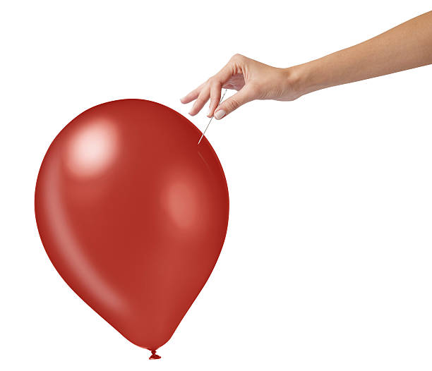 toma de estudio de una mujer sosteniendo una aguja cerca del globo rojo - balloon inflating blowing isolated fotografías e imágenes de stock