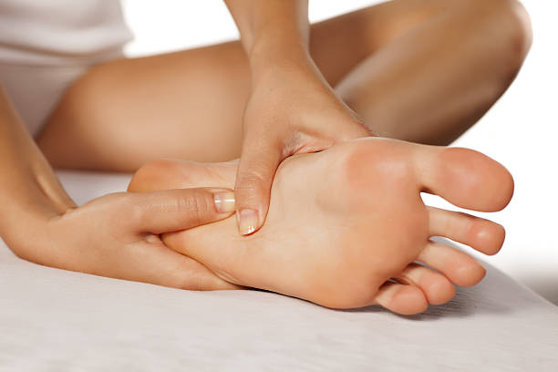 woman massaging her tired feet