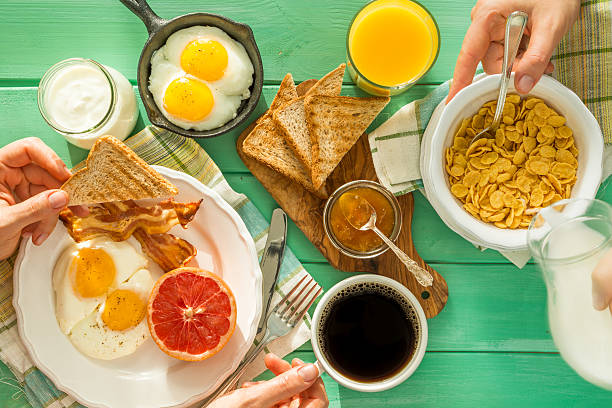 istock Family having summer breakfast, top view 637367274