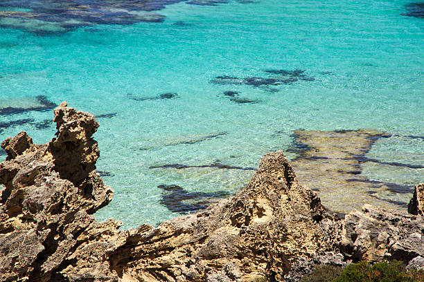 istock Aqua blue ocean water and wind crated rock 637370162