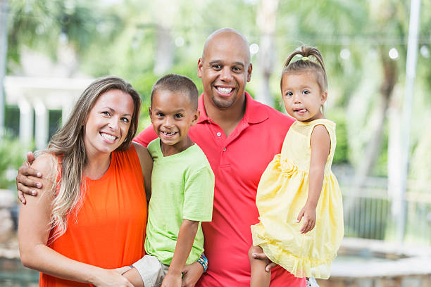 istock Happy mixed race family with two children 637370282