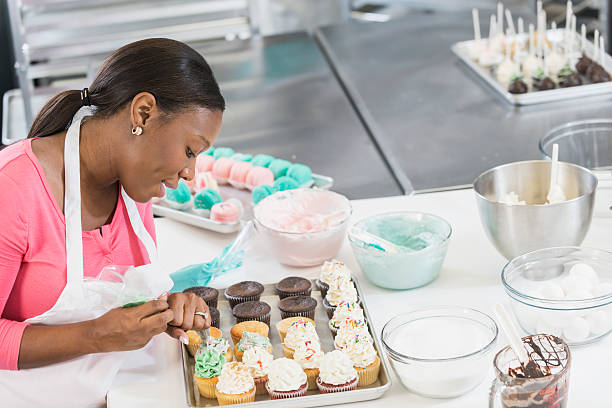istock African American woman working in bakery kitchen 637371032
