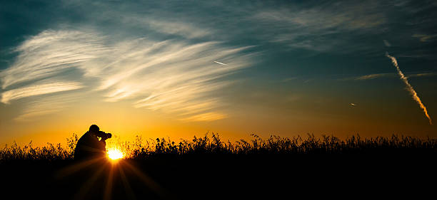 istock Silhouette of the photographer 637373292