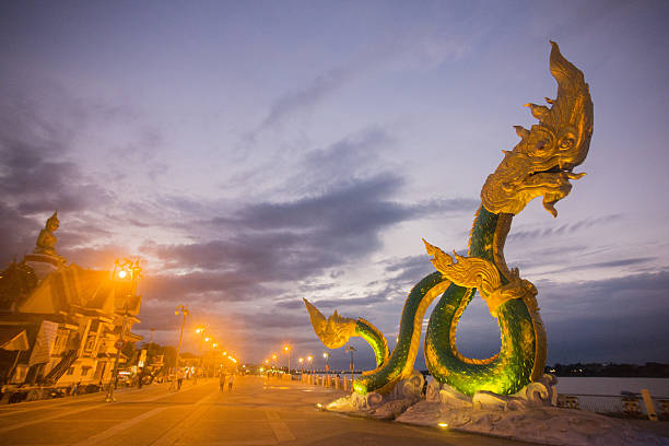 Phayanak on Mekong River, Thailand a Phayanak or Naga Statue at the mekong river in the town of Nong Khai in Isan in north east Thailand nong khai stock pictures, royalty-free photos & images