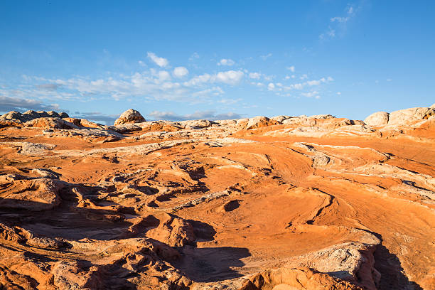 istock Bright orange sandstone mixed with white layers at sunrise 637375886