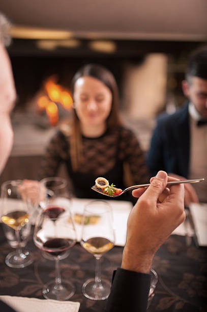 istock Small Group of Friends Enjoying a Tasteful Dinner Together 637376600
