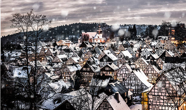 istock Wonderful small winter village in snow 637377884
