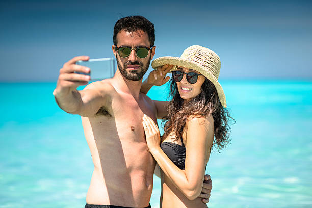 istock Happiness couple at the seaside take a selfie 637378638