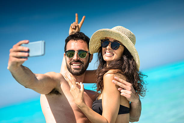 istock Happiness couple at the seaside take a selfie 637378670