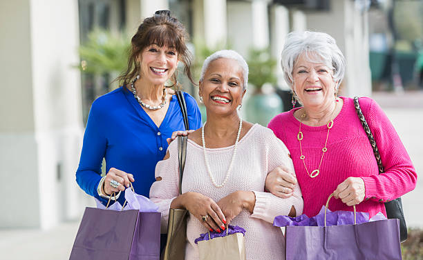 istock Three multi-ethnic senior women out shopping 637384914