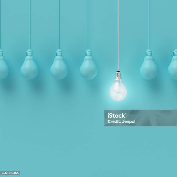 Hanging Light Bulbs With Glowing One Different Idea Stock Photo - Download Image Now