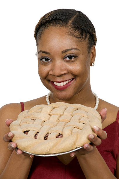 Beautiful African American black woman holding a freshly baked pie