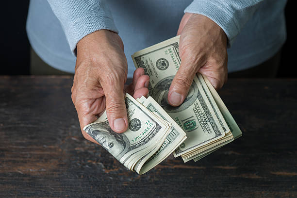 istock Man hand holding money,bribery concept. 637389794