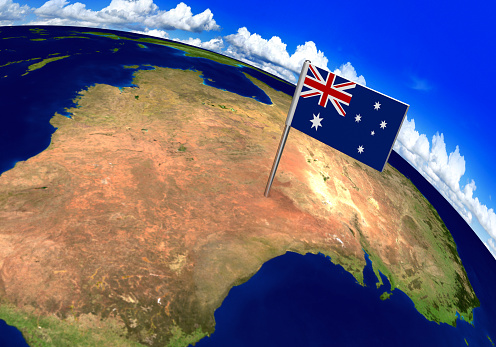 3D world render with the Australian flag over the location of Australia. Parts of this image furnished by NASA.