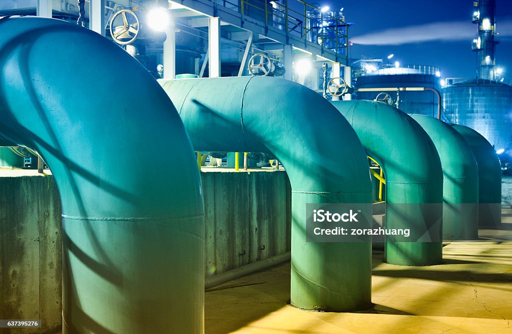 Oil Refinery Pipeline Close-up oil refinery pipeline equipment at night. Natural Gas Stock Photo