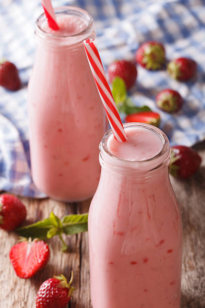 istock homemade strawberries milkshake macro in a bottle. vertical 637396968