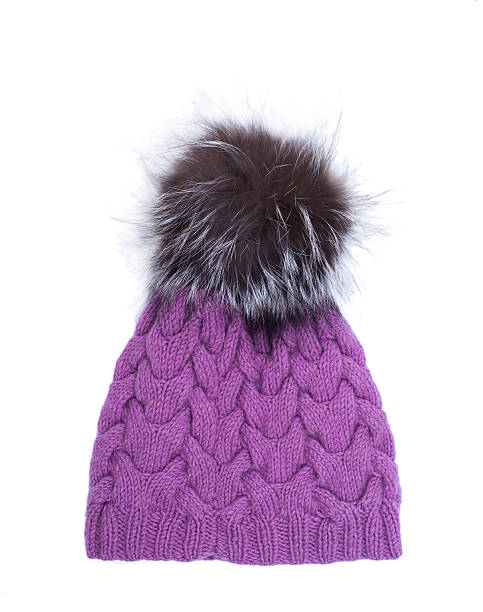 istock Violet knitted woolen hat with pompom isolated on white background. 637397112