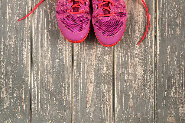 istock Trainers on wood floor. 637397972