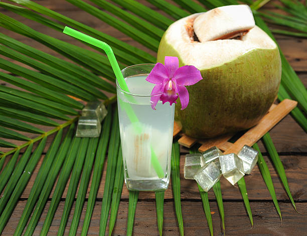 istock Fresh Coconut Water Drink on wood 637399646