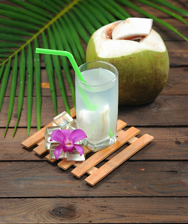 Fresh Coconut Water Drink on wood