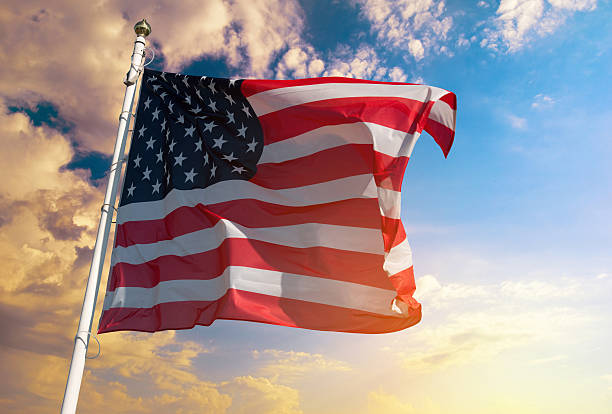 istock American flag on the background of sky 637400034
