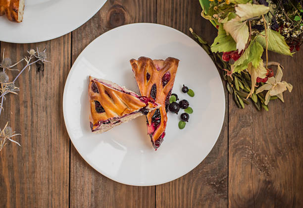 istock sweet pie with berries assorted, cherry, strawberry, blueberry, Apple, currants 637402042
