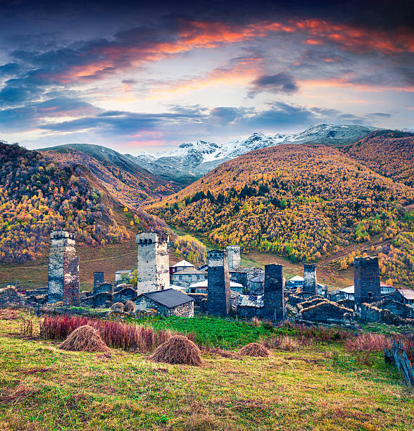 Colorful autumn sunset in the famous highest inhabited village in Europe - Ushguli. UNESCO World Heritage Site, Upper Svaneti, Georgia. Artistic style post processed photo.