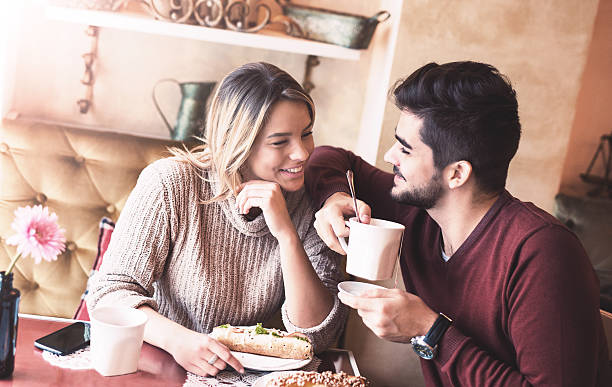 istock Romantic loving couple on a date in the cafe 637404730