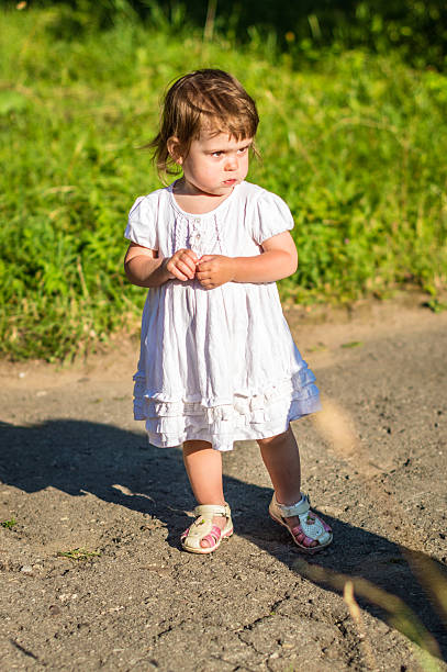 istock little girl walks in the Park 637407592