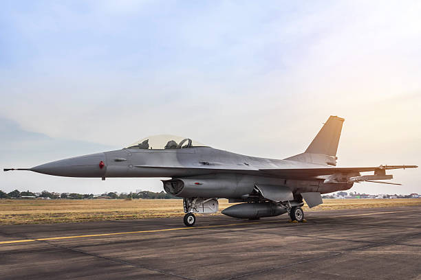 istock fighter jet military aircraft parked in the runway 637408246