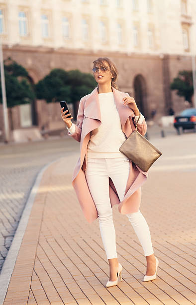 istock Beautiful woman texting on the phone 637408458