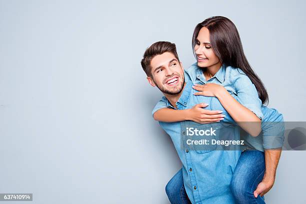 Happy Man Carrying His Girlfriend On The Back Stock Photo - Download Image Now - Boyfriend, Couple - Relationship, Friendship