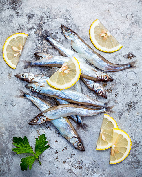 istock Fresh catch Shishamo fish fully eggs flat lay on shabby 637411044