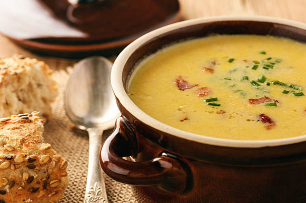 istock Corn cream soup with bacon (chowder) on wooden background. 637412430