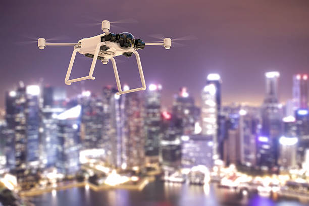 istock flying drone in city 637413600