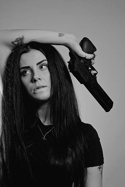 istock Tough girl with gun 637414266