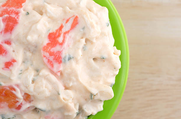istock Lobster dip in green bowl on wood table top 637414562
