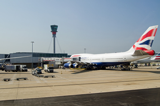 London, UK - June 9, 2016:  A British Airways jumbo jet at a stand at London Heathrow Airport Terminal 5 on a sunny Summer morning.