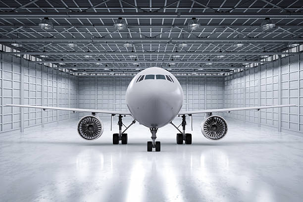 aereo in hangar - hangar foto e immagini stock