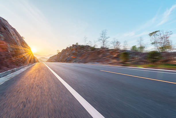 istock Motion blur highway with sunset or sunrise background. 637416786