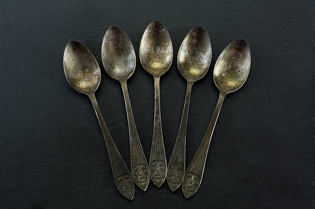 istock Vintage spoon set on dark background. 5 vintage spoons. 637421148
