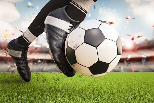 istock soccer player kicking soccer ball in motion 637421316